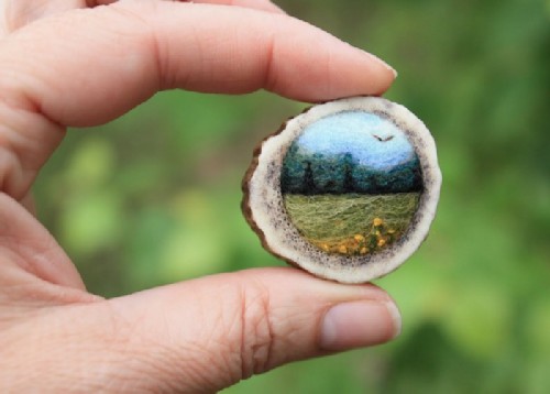 Wooden brooch with felt landscape