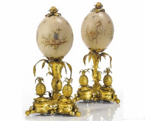 A beautiful rare pair of ostrich eggs from the time of Louis XV on gilded bronze stands, painted in chinoiserie style. France, circa 1760