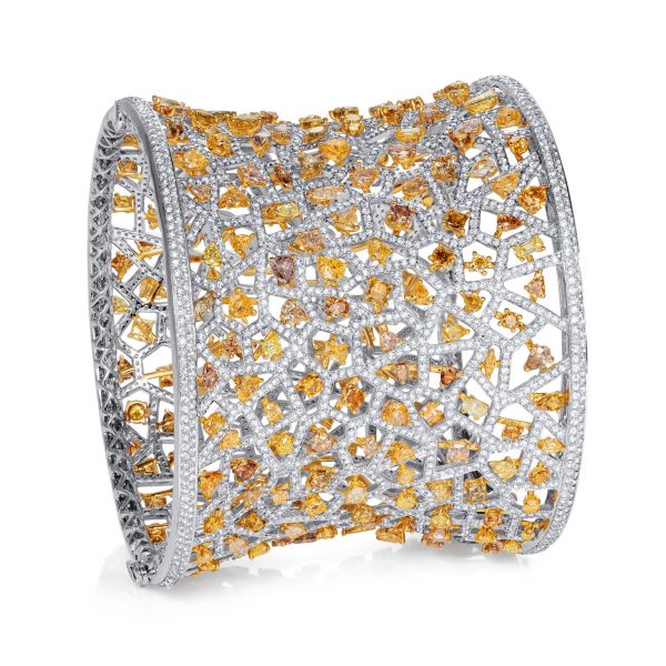 Art Deco inspiRed high jewellery cuff embellished with fancy Diamonds. The 18k White Gold geometric mesh is pavéd with over 3,000 shimmering White Diamonds.