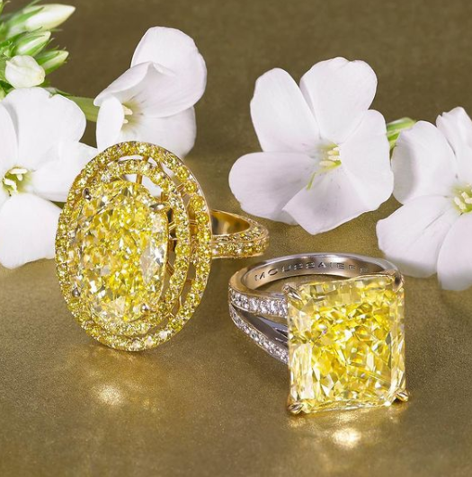 Rings with a 10.92 carat yellow oval diamond and a 13.82 carat yellow rectangular diamond.