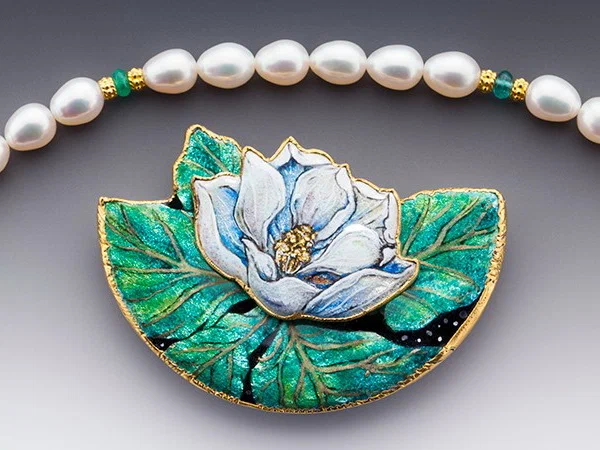 Magnolia necklace, gold, enamel, cultured freshwater pearls, emerald, sapphire.