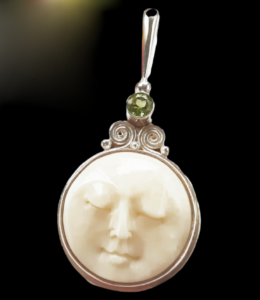 Sajen Vintage pendant Sleeping Moon, carved bone and chrysolite.
