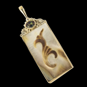 Vintage pendant with mystic topaz and carved real mother-of-pearl insert.