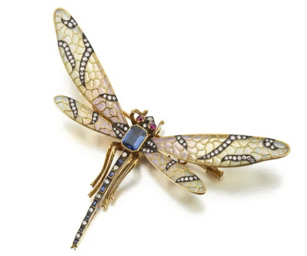 Dragonfly brooch set with rubies sapphires and diamonds.