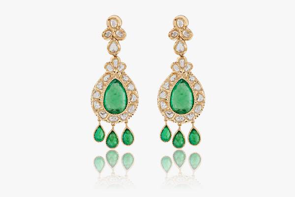 Yellow gold earrings set with emeralds and rosettes. This sumptuous piece enhanced by magnificent emeralds is an essential accessory to sublimate a head wear. Yellow gold earrings set with emeralds and rosettes. This sumptuous piece enhanced by magnificent emeralds is an essential accessory to sublimate a head wear.