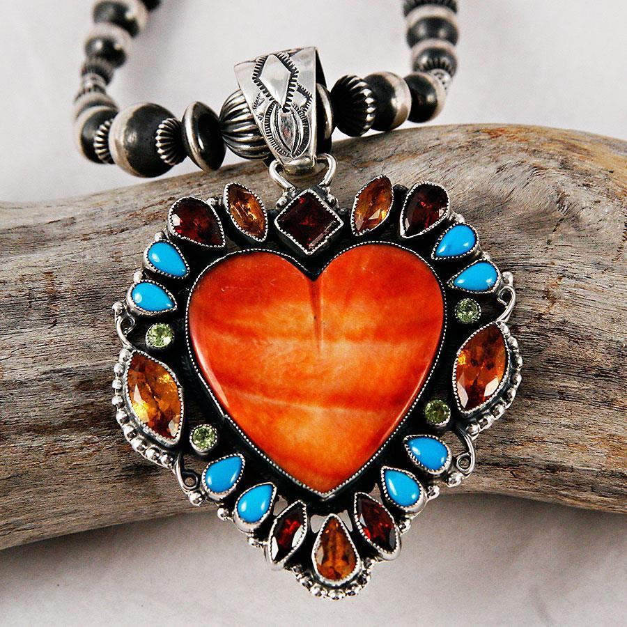 Necklace with a large tiger eye pendant.