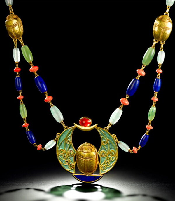 Egyptian style scarab necklace in hammered gold with enamel wings and lapis lazuli, jade and coral beads, Marcus & Co., circa 1905.