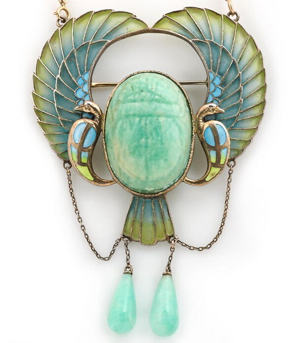 Gilt silver pendant brooch in the form of an amazonite scarab surrounded by stylized peacocks, decorated with stained glass enamel, circa 1920.