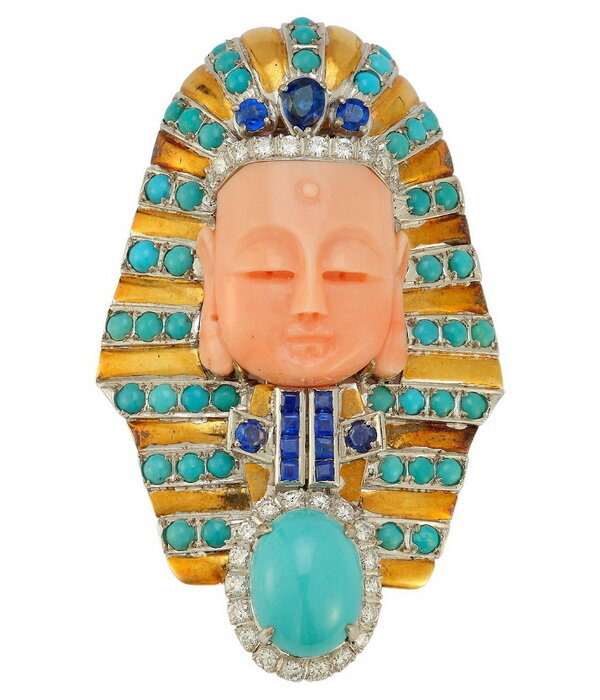 Gold brooch in the form of a pharaoh's mask, coral, turquoise, diamonds, sapphires, Trio, circa 1980.
