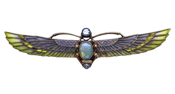 Winged brooch in silver with a carved opal scarab, decorated with stained glass enamel, Austria, circa 1915.