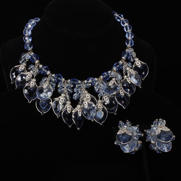 Set of necklace and earrings with blue crystals.