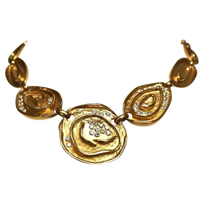 BALENCIAGA gilt necklace with glass crystals.