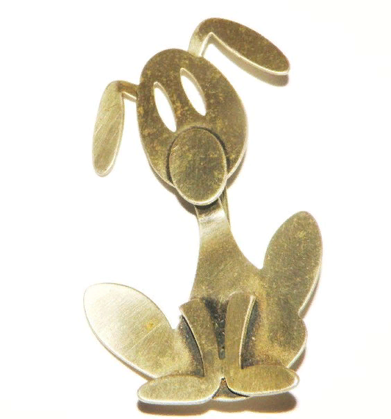 Silver brooch in the shape of a dog.