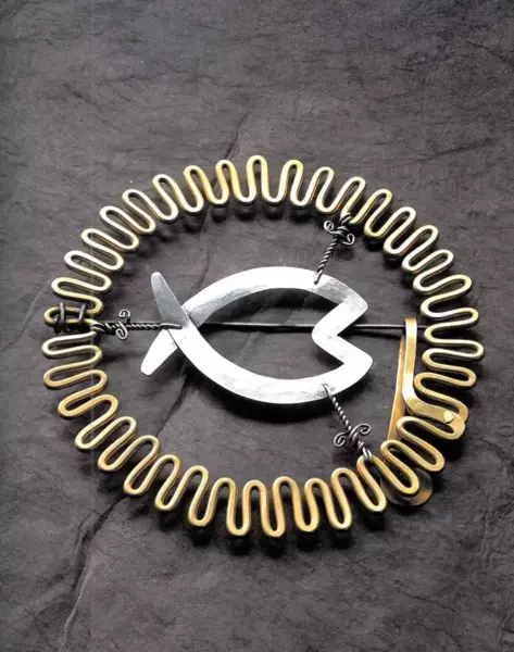 Silver fish brooch.