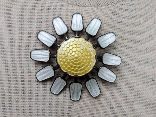 Sun brooch, guilloché enamel, blackened silver.