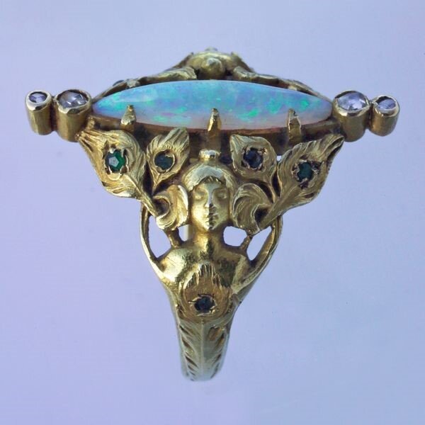 Art Nouveau ring in gold with opal, rubies, emeralds and diamonds, France, circa 1900.