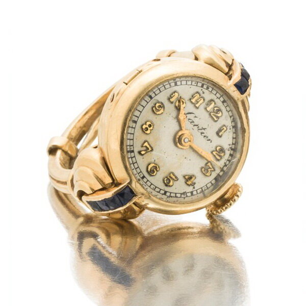Cresarrow ring watch in gold with sapphires and diamonds, retailed by Cartier, Whiteside & Blank, mid 20th century.
