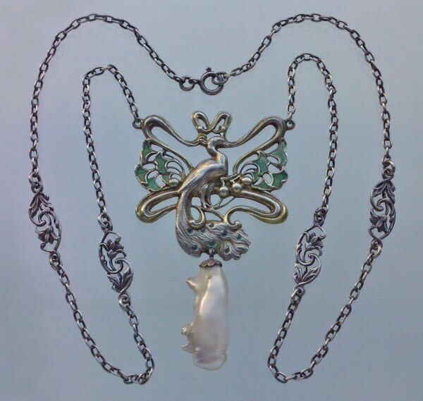 Gilt silver peacock pendant with stained glass enamel and baroque pearl, Janvier Quercia, France, circa 1900.