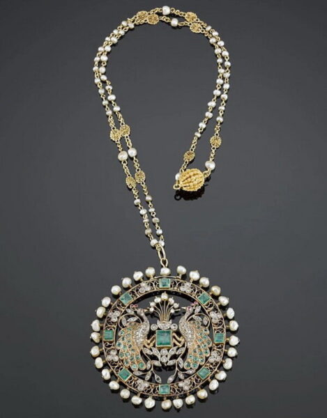 Openwork pendant in gold and silver with diamonds, emeralds, rubies and pearls, probably France, circa 1900.