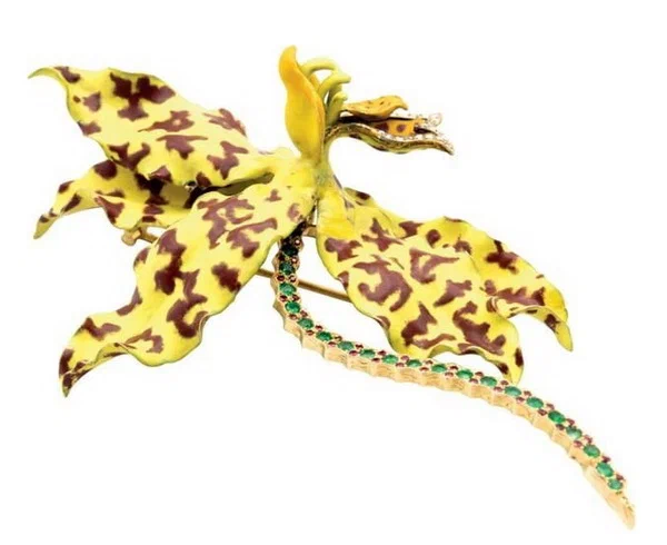 Tiger orchid grammatophyllum speciosum brooch Indonesian orchid design by Paulding Farnham gold enamel diamonds emeralds Tiffany Co circa 1890.