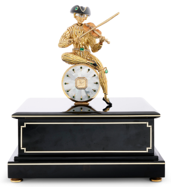 Automatic lacquer music box LE CHÂTELAIN, topped with a gold watch and a commedia dell'arte figurine in gold with emeralds and diamonds, height 32 cm, Mauboussin, 1988.