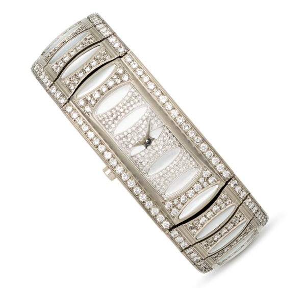 Bracelet watch in white gold with mother of pearl and diamonds, Mauboussin.