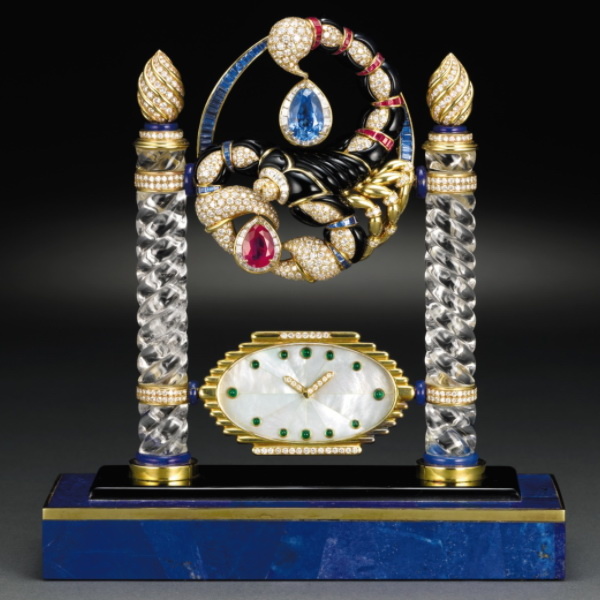 Mantel clock and brooch Emperor Scorpio, gold, mother of pearl, lapis lazuli, onyx, rock crystal, emeralds, rubies and diamonds, height 18 cm, Trabert & Hoeffer Mauboussin, circa 1985.