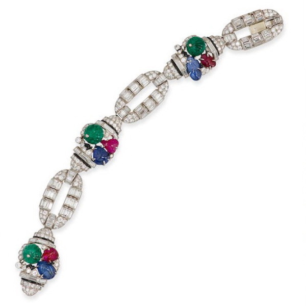 White gold bracelet with carved sapphires, emeralds, rubies and diamonds, Mauboussin, circa 1930.