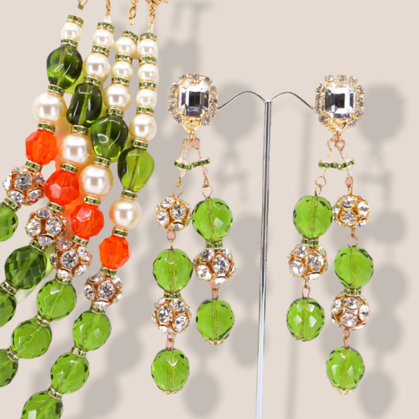 These gold tone earrings feature a stunning design with really large three dimensional beads.