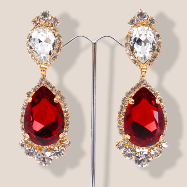 gold tone statement earrings feature a drop earring regal design on a three dimensional structure.
