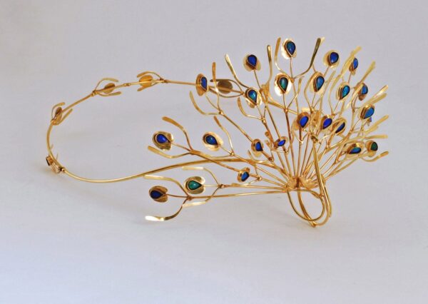 ⠀Yellow gold tiara with thirty five Australian opals called James Love Peacock 1981