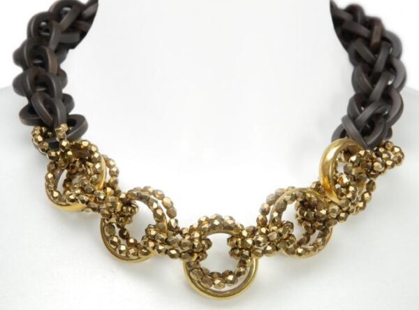 Black acrylic necklace with gold beads.