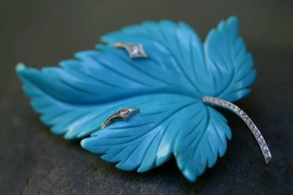 Blue leaf brooch.