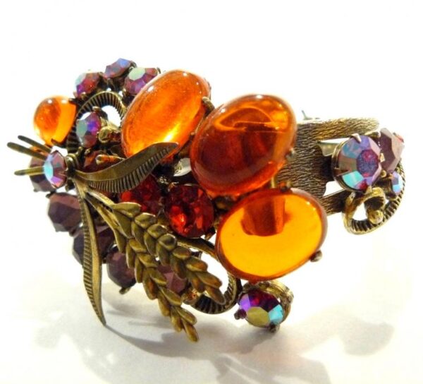 Brooch with amber and rhinestones.