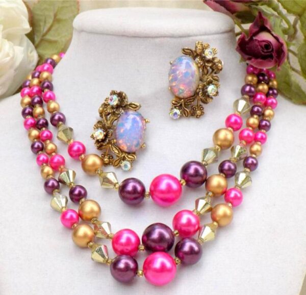Earrings with opals and a necklace of multi colored beads in three rows.