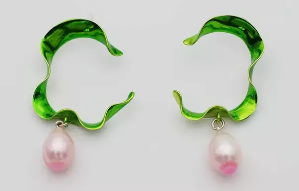 Earrings with pearls.