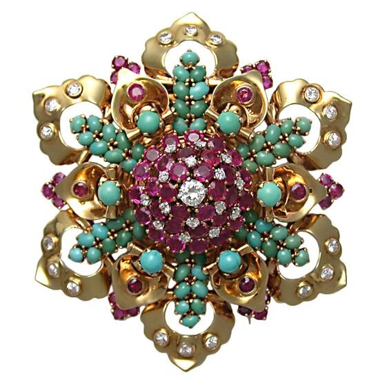 Flower brooch with turquoise, rubies, diamonds.