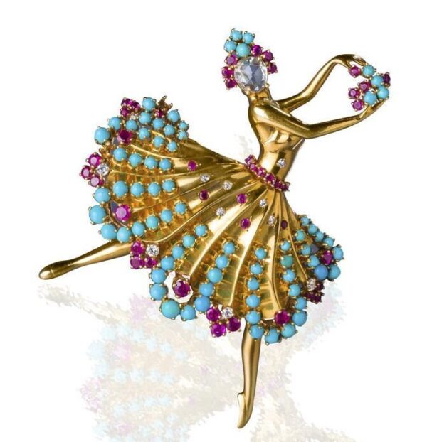Gilded brooch with turquoise.