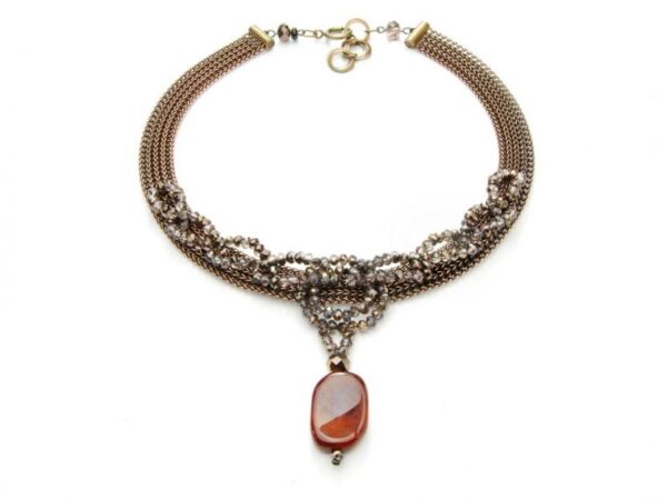 Gold tone necklace with pendant.