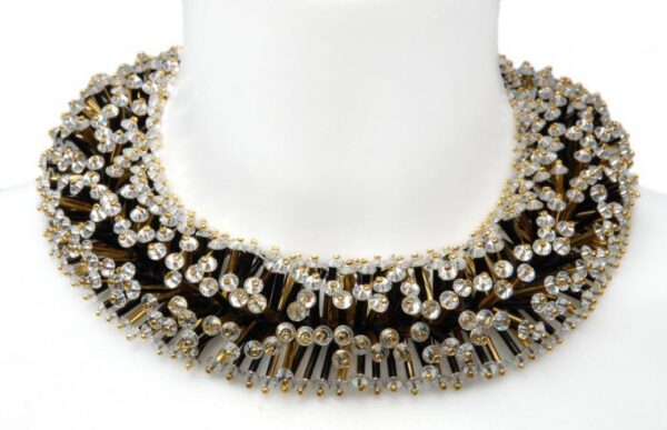 Necklace in the form of fir tree branches, golden beads and transparent beads.