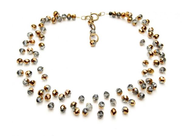 Necklace made of gold and silver beads on an invisible line.
