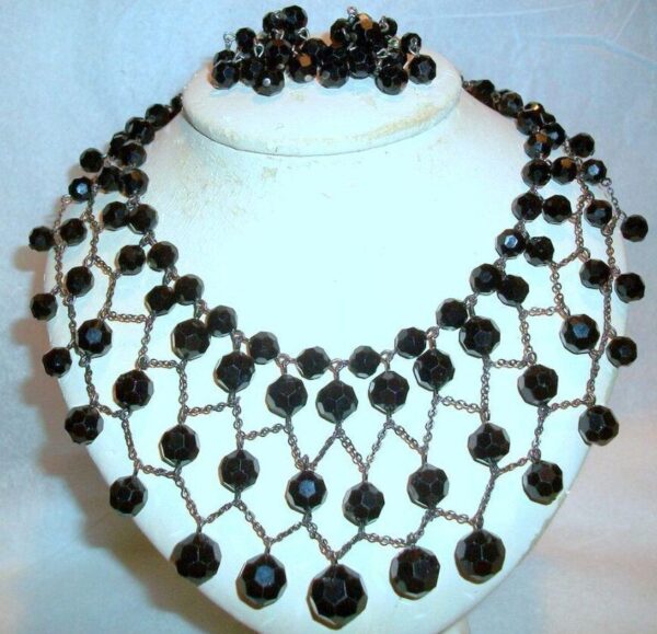 Necklace mesh bib with black beads. Necklace mesh bib with black beads.