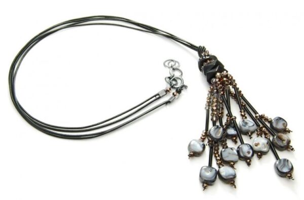 Necklace on three leather cords with mother of pearl beads.