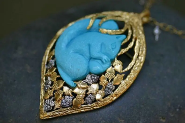 Pendant with squirrel and pine cones.