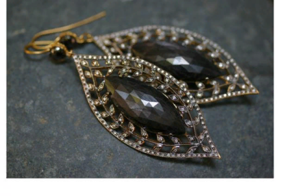 Ravenna earrings in twenty two carat gold with white and black diamonds.