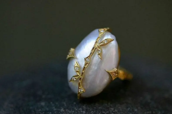 Ring with a pearl.