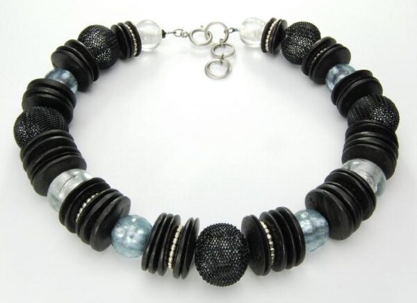 Silver and black necklace made of buttons and beads.
