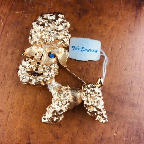 Staret Poodle brooch with Rhinestones in Gold Tone metal.