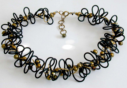 Wire necklace with golden beads.